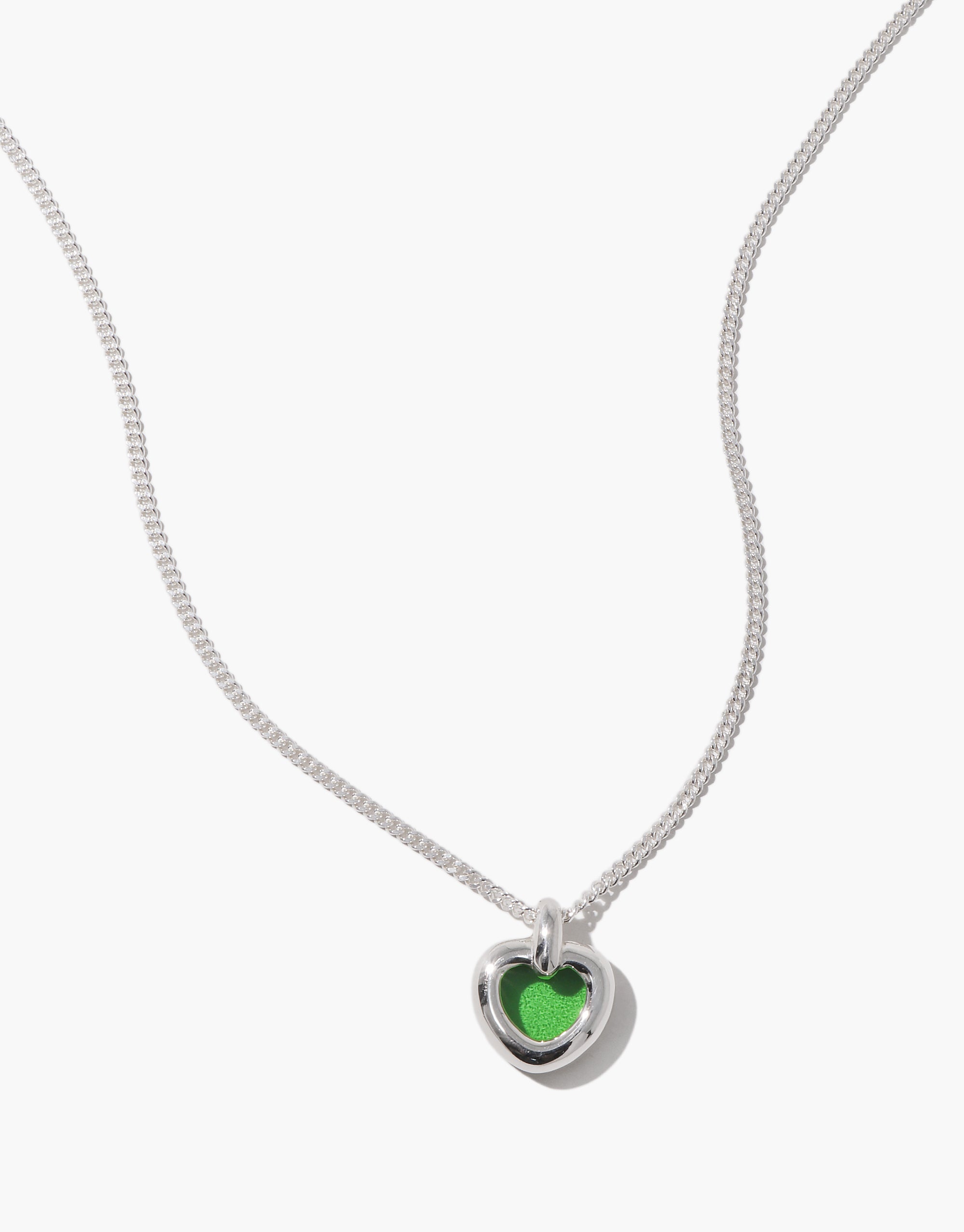 Core Heart Necklace | Small features a silver chain with a lightweight, softly rounded green heart pendant, embodying CLED's eco-conscious design by transforming discarded glass into elegant jewelry.