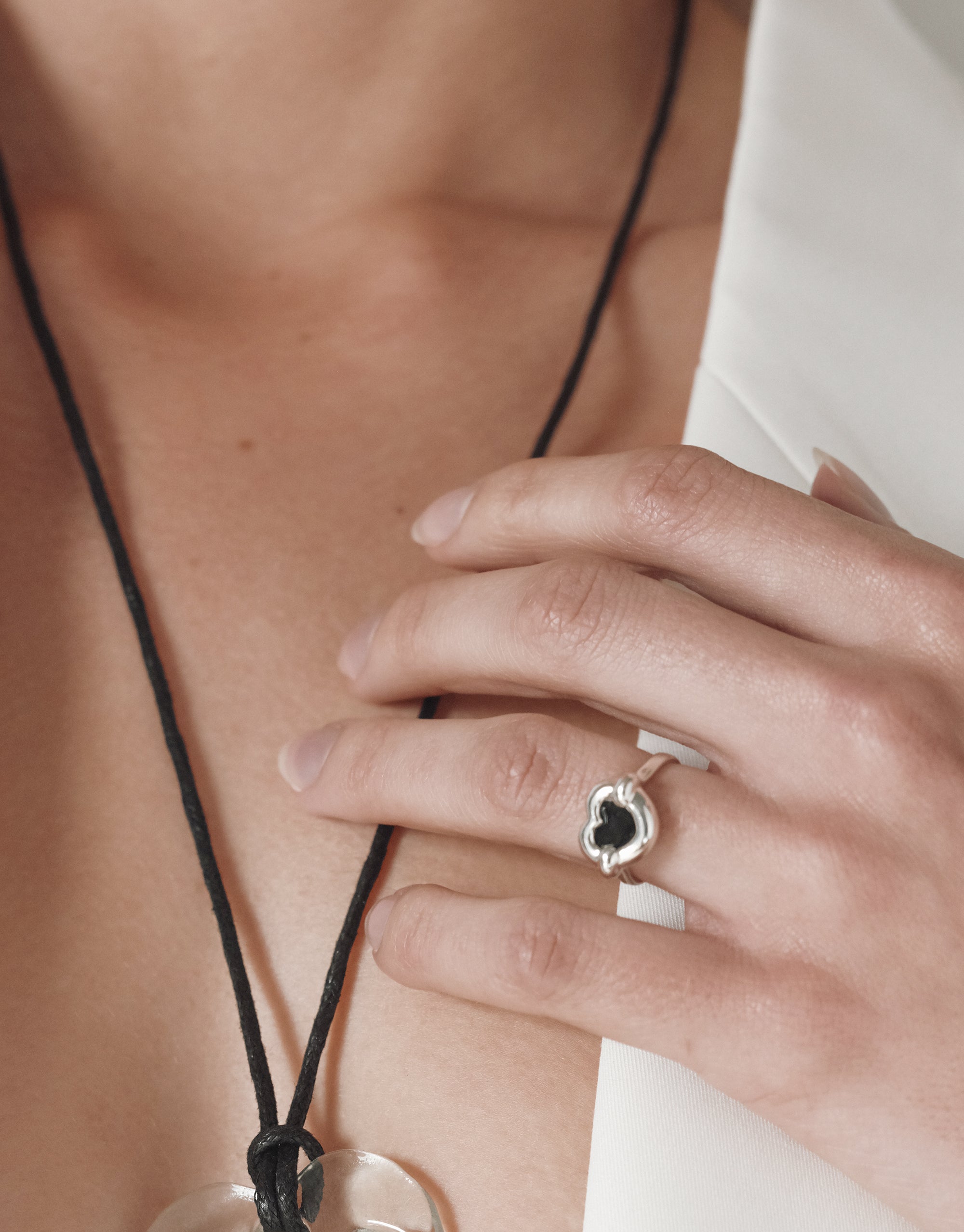 Core Heart Ring | Small on a hand, showcasing its smooth, seamless, puffy design. This modern classic from CLED adds a sculptural touch, embodying sustainable elegance.