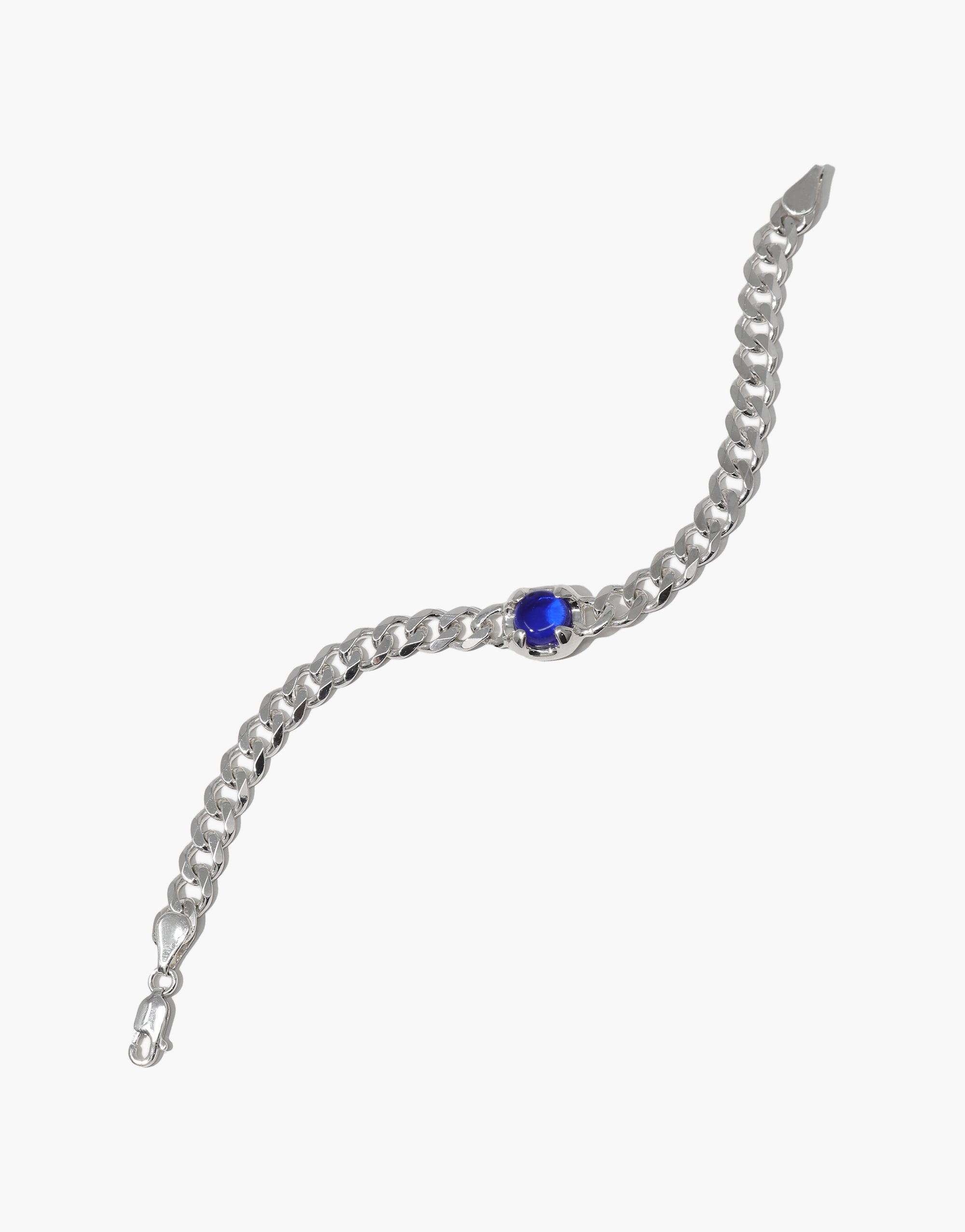 Beam Bracelet: A silver bracelet featuring a prominent blue eco gem, crafted from upcycled glass, showcasing CLED's dedication to eco-conscious jewelry design.