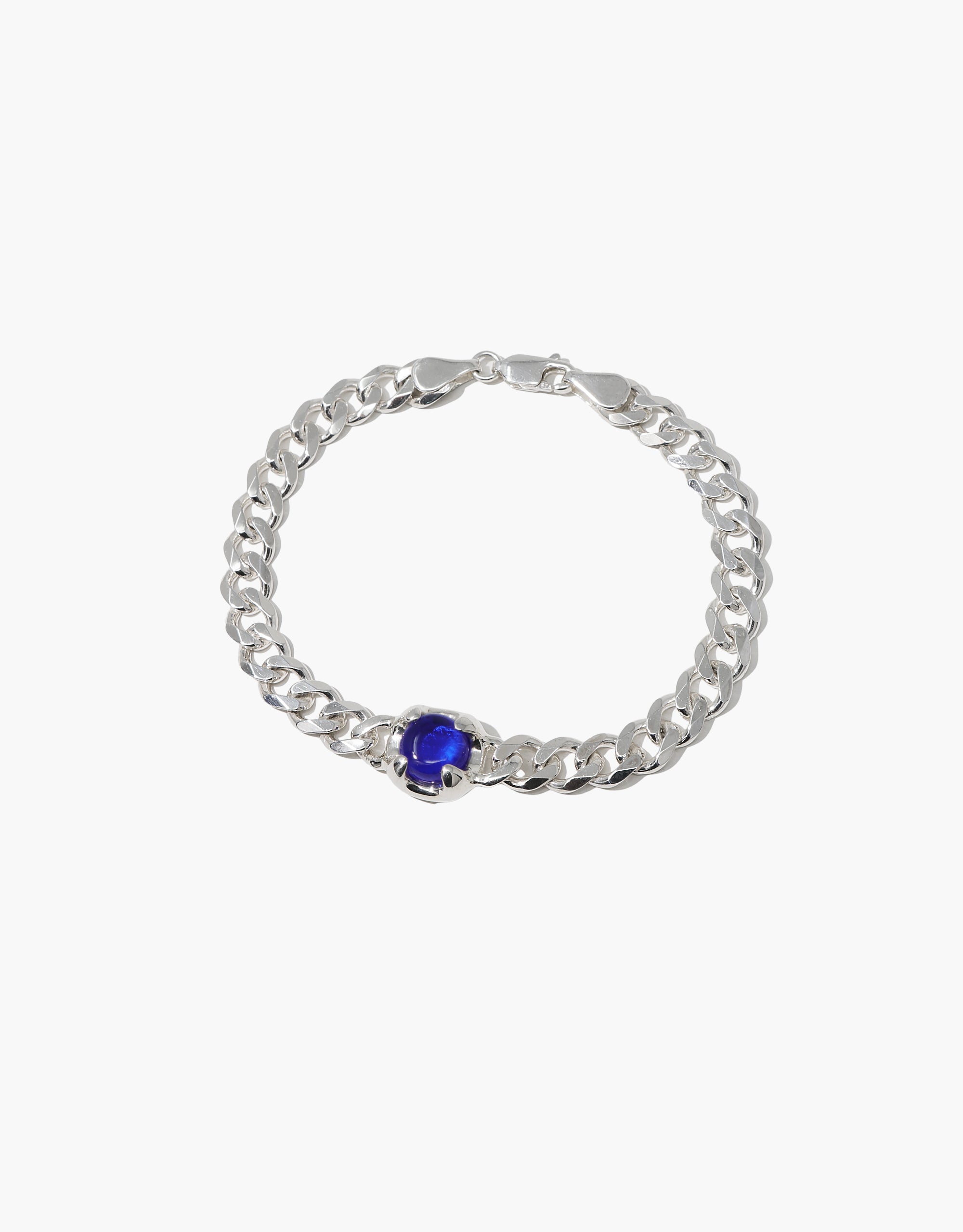 Beam Bracelet: A silver bracelet featuring a blue Eco Gem stone, crafted from upcycled glass, reflecting CLED's eco-conscious design ethos.