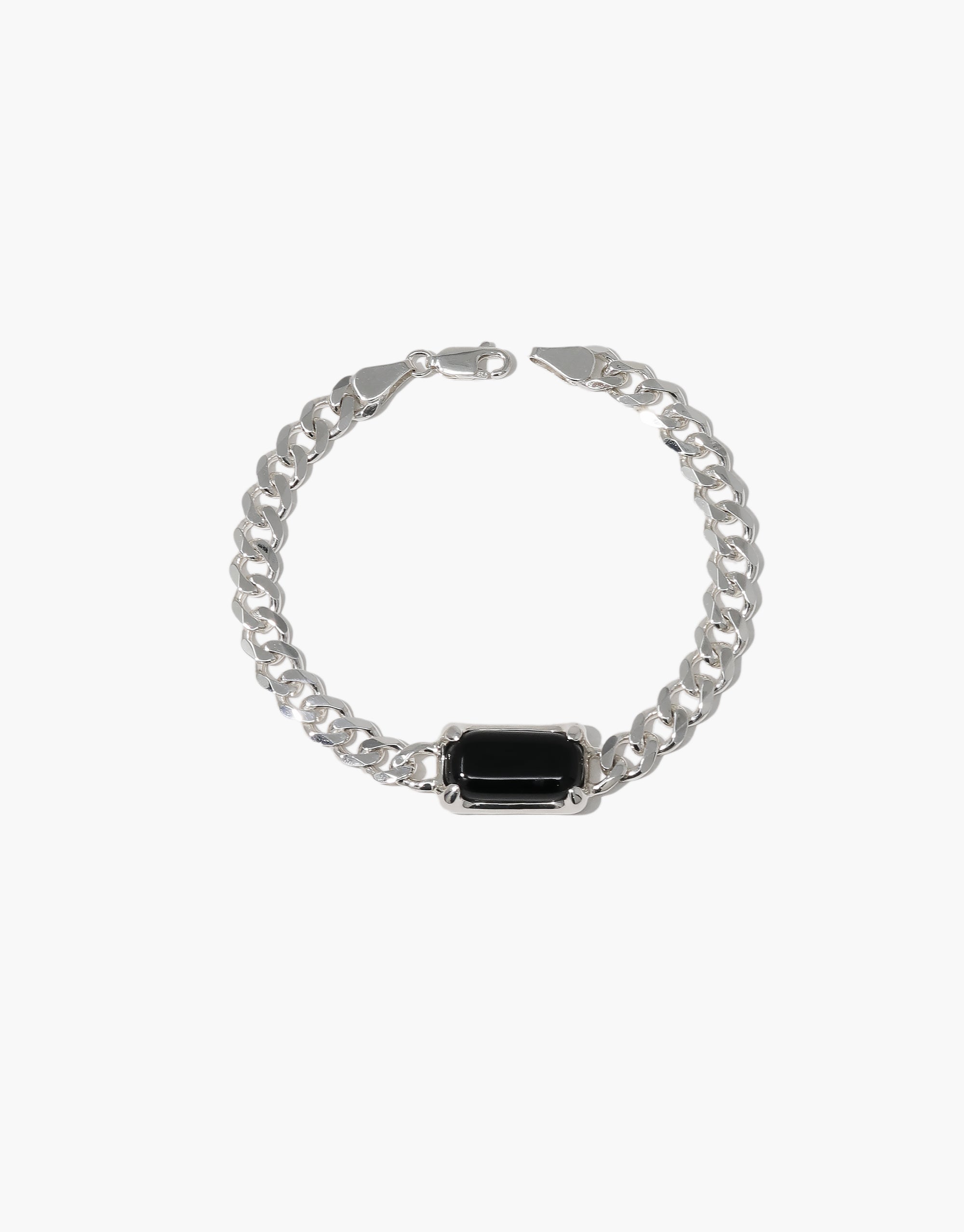 Prism Bracelet: A silver bracelet featuring a hand-formed black Eco Gem, crafted from repurposed glass, exemplifies CLED's eco-conscious design ethos.