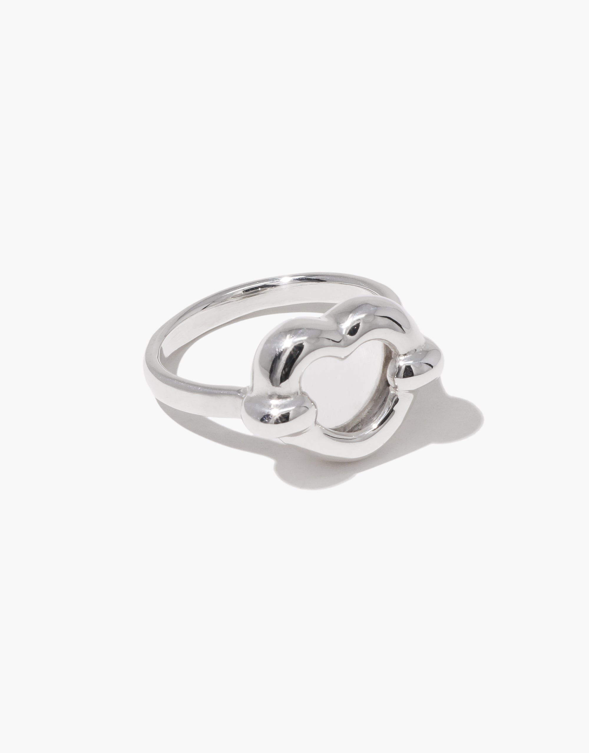 Core Heart Ring | Small: A silver ring featuring a clear heart, showcasing a seamless, sculptural design. Minimal yet bold, this eco-conscious piece from CLED adds a modern touch to any outfit.